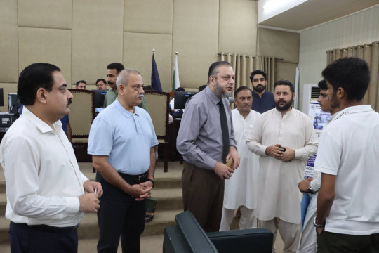 Vice Chancellor Prof. Dr. Muhammad Kamran interacts with applicants for Fall 2025 admission at the Admission Cell